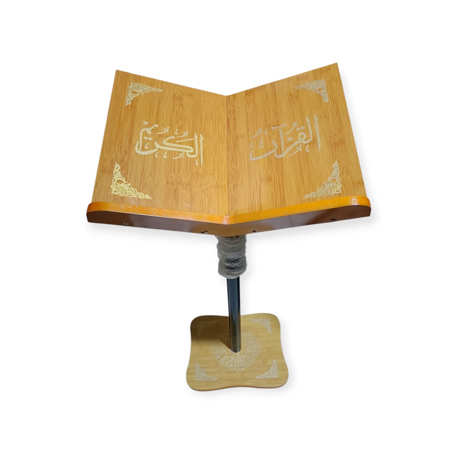 Wooden Quran stand with open pages on a white background